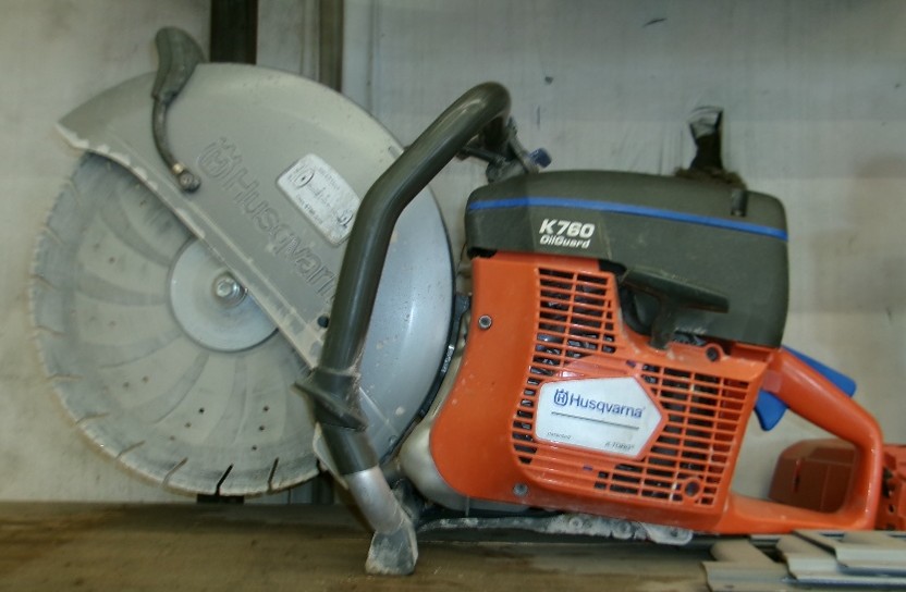 Husqvarna Concrete Saw sitting on table at Hitchin Post Trailer and Tractor Sales Rentals